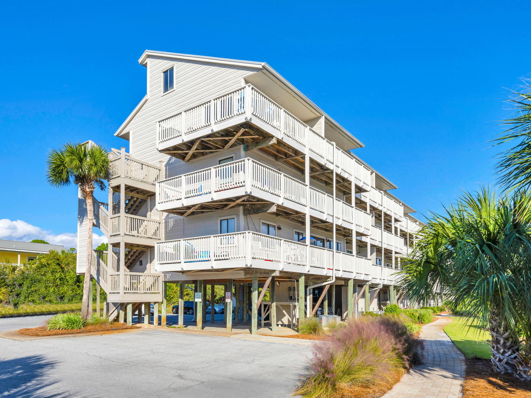 145 Beachfront Trail, Unit 307A Santa Rosa Beach, FL 32459 - Photo 60 of 60 a front view of a building with garden