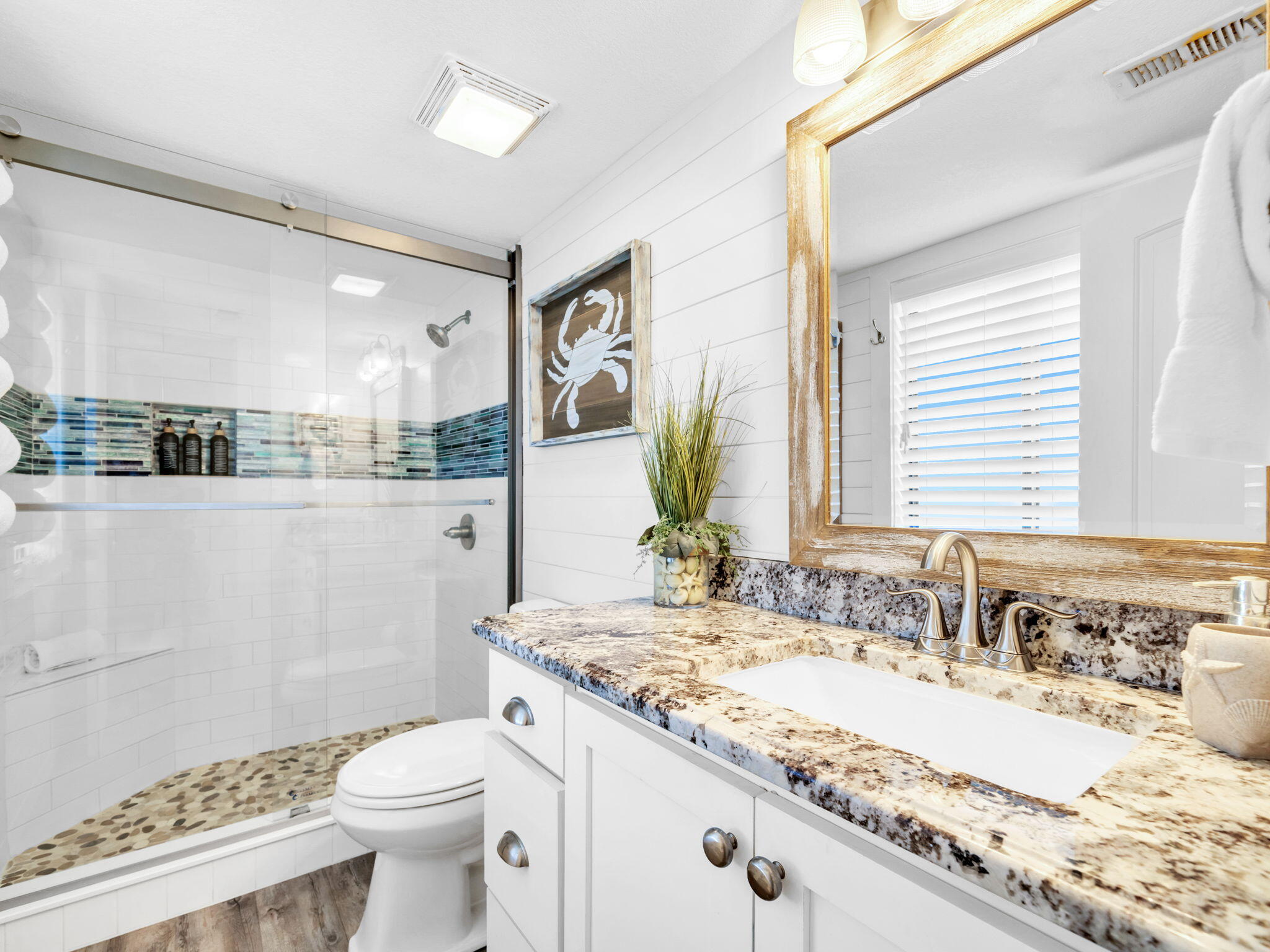 145 Beachfront Trail, Unit 307A Santa Rosa Beach, FL 32459 - Photo 10 of 60 a bathroom with a granite countertop sink mirror vanity and toilet