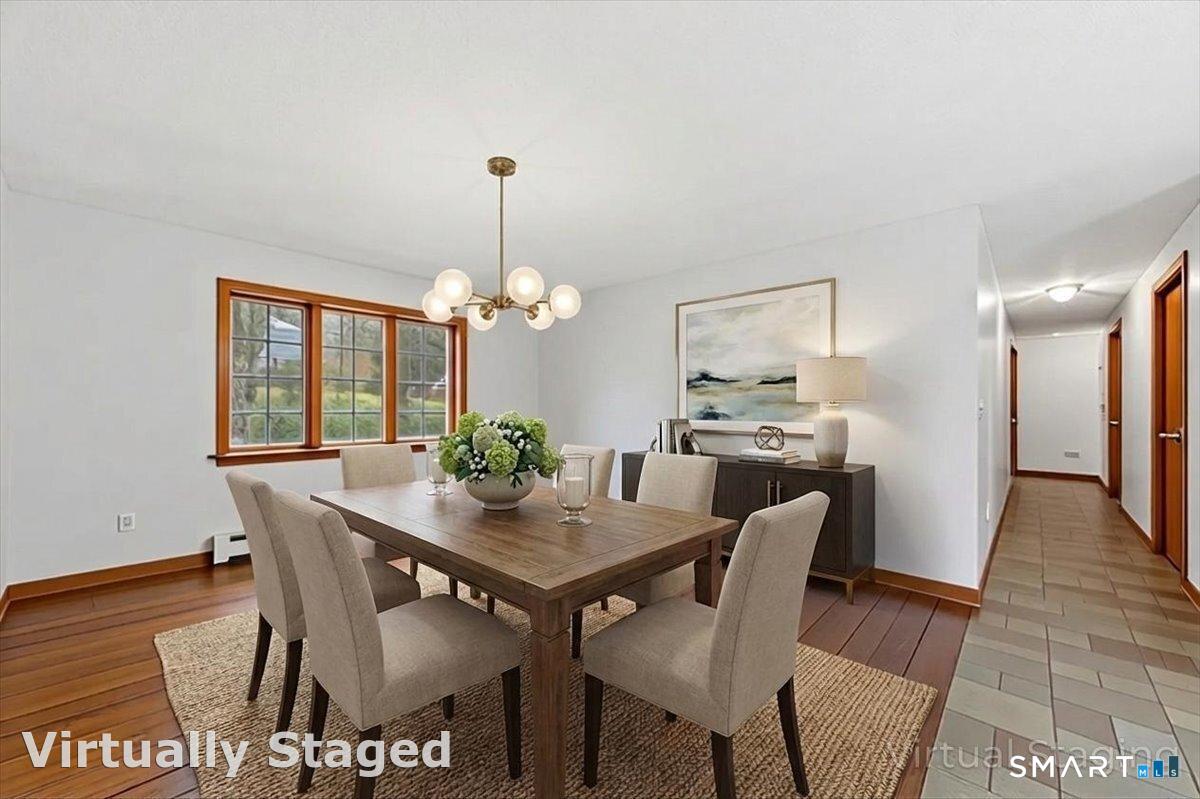 21 4 Mile River Road Old Lyme, CT 06371 - Photo 14 of 40 a view of a dining room with furniture window and wooden floor