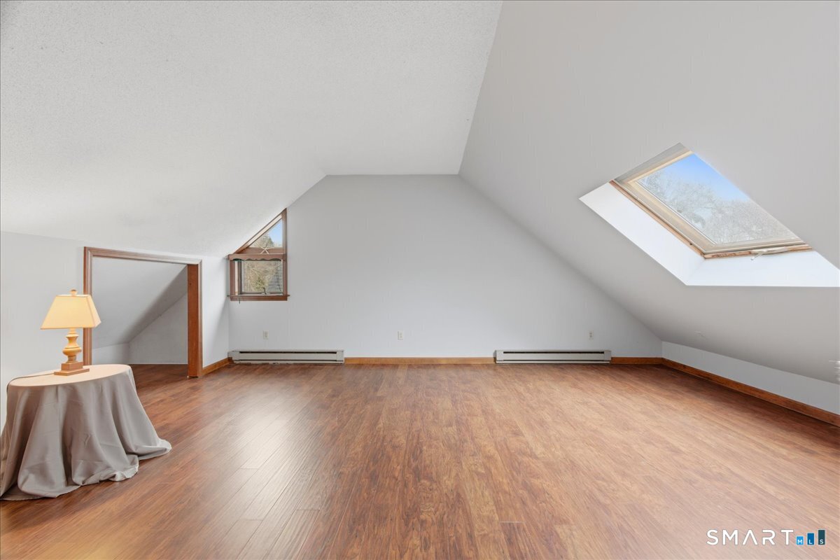 21 4 Mile River Road Old Lyme, CT 06371 - Photo 25 of 40 a view of an empty room and wooden floor