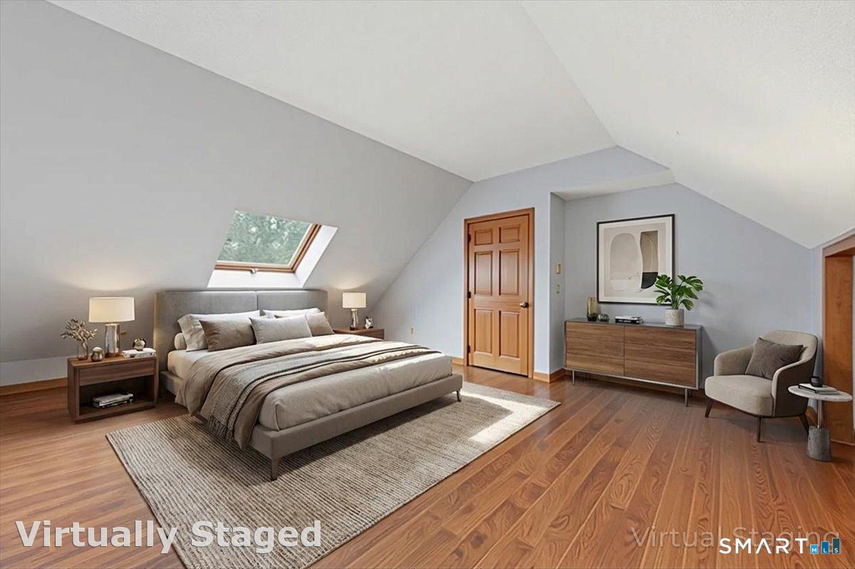 21 4 Mile River Road Old Lyme, CT 06371 - Photo 26 of 40 a bedroom with a bed and a couch