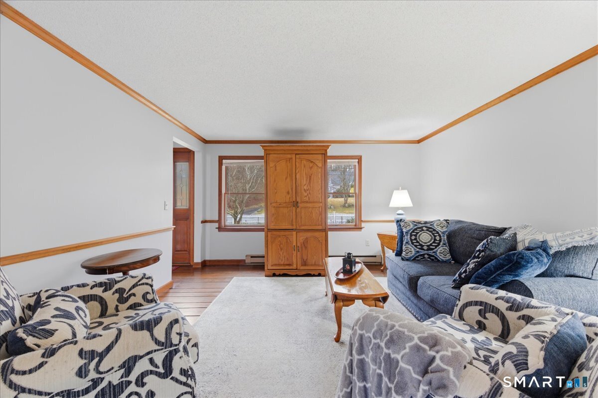 21 4 Mile River Road Old Lyme, CT 06371 - Photo 7 of 40 a living room with furniture and a window