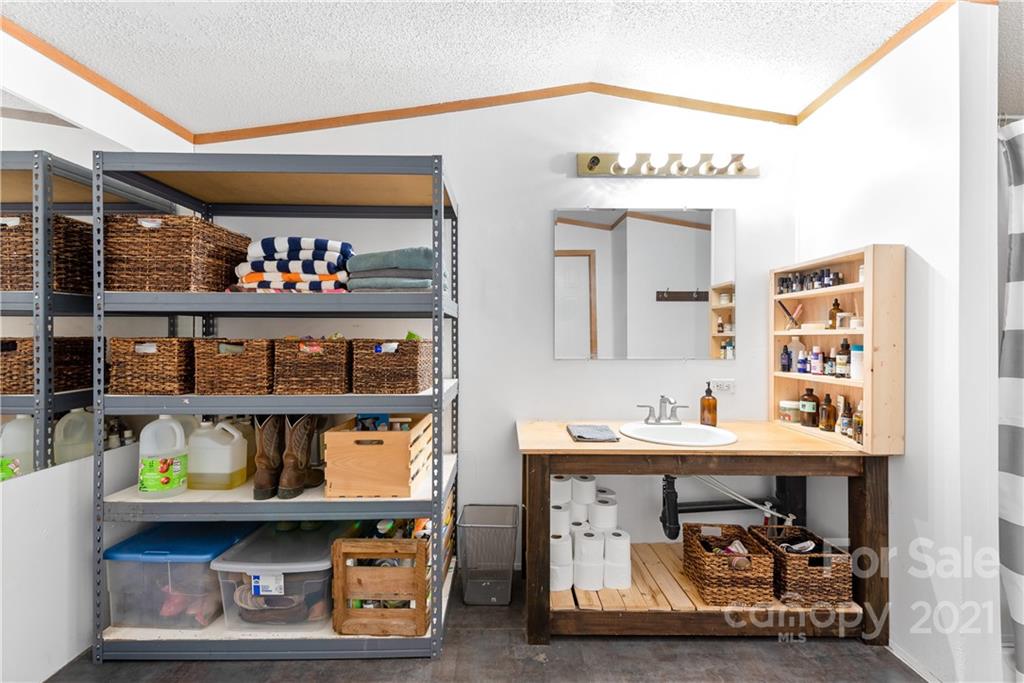 3 Buckner Road Leicester, NC 28748 - Photo 12 of 28 a store room with storage and a table