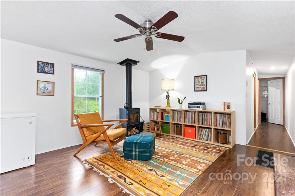 3 Buckner Road Leicester, NC 28748 - Photo 15 of 28 a living room with furniture a rug and a window