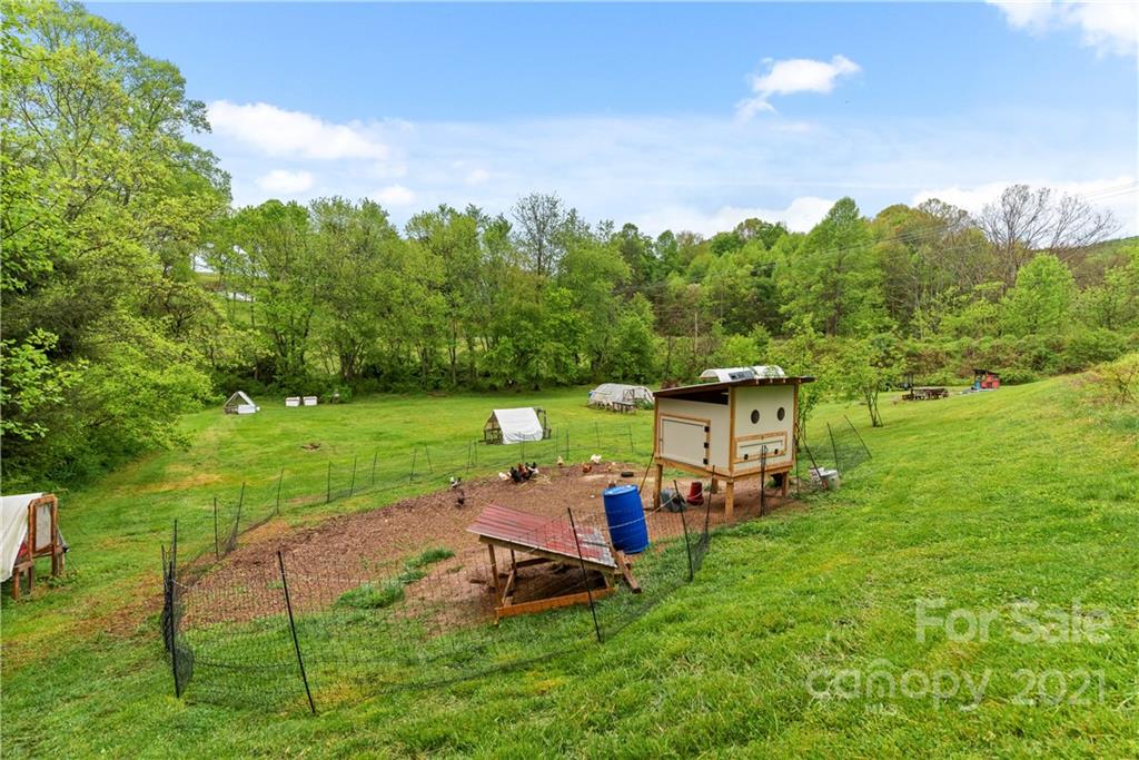 3 Buckner Road Leicester, NC 28748 - Photo 22 of 28 a view of a chairs in a backyard