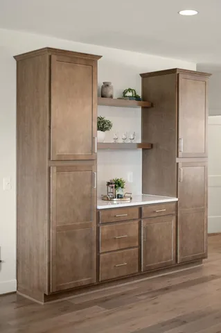 a living room with furniture and large window