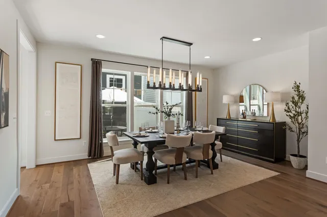 a view of a dining room with furniture and window