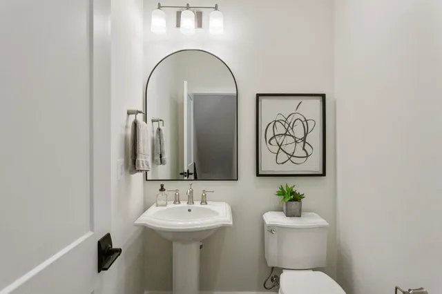 a view of a patio with table and chairs under an umbrella
