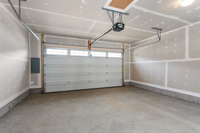 a bedroom with a bed and painting on the wall
