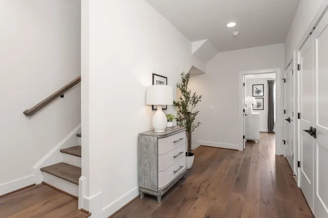 a bathroom with a double vanity sink toilet and shower