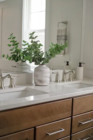 a living room with furniture and a kitchen