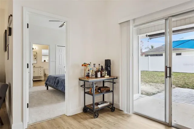 a view of a bedroom with a bed and glass door