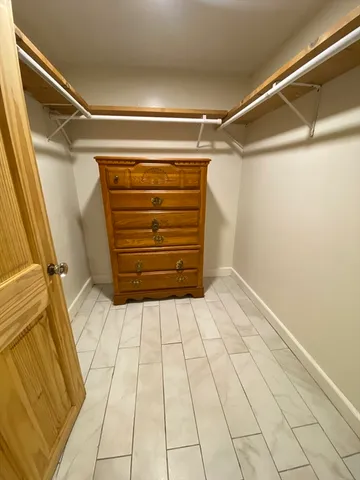 a view of a house with a tree front of house