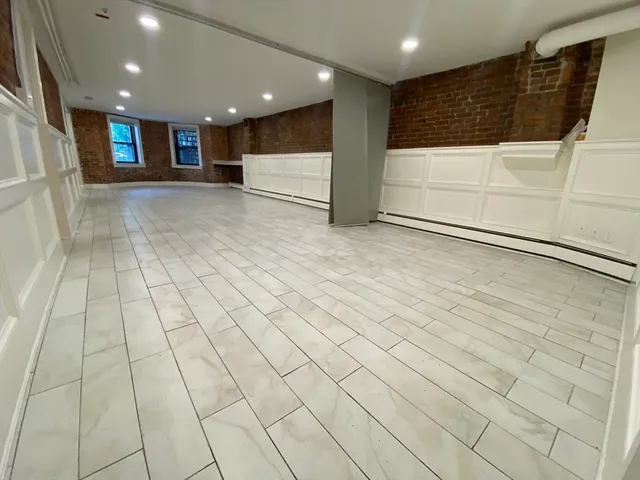 a view of a hallway with stairs