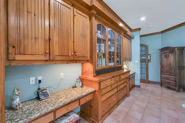 a kitchen with stainless steel appliances granite countertop a stove and a refrigerator