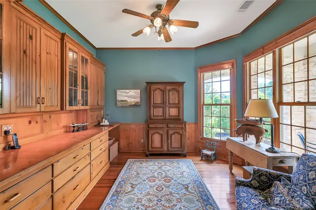 a bathroom with a granite countertop sink toilet and mirror