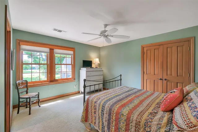 a bedroom with a bed and window