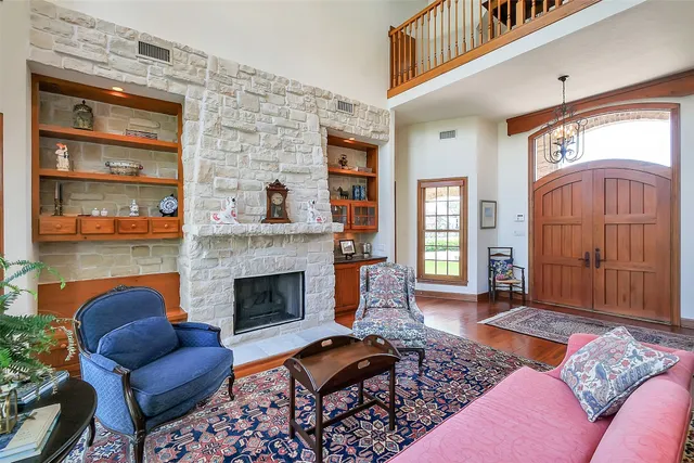 a living room with furniture and a fireplace