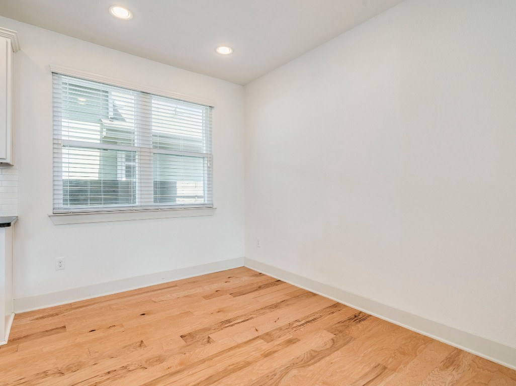 2309 Hermia Street Austin, TX 78741 - Photo 14 of 30 a view of empty room with wooden floor and fan