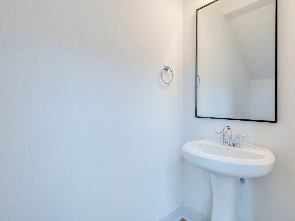 2309 Hermia Street Austin, TX 78741 - Photo 19 of 30 a bathroom with a sink and mirror