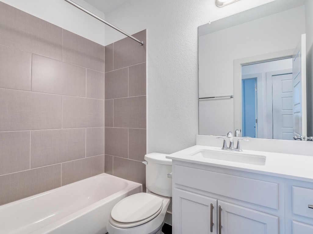 2309 Hermia Street Austin, TX 78741 - Photo 24 of 30 a bathroom with a sink a toilet and shower