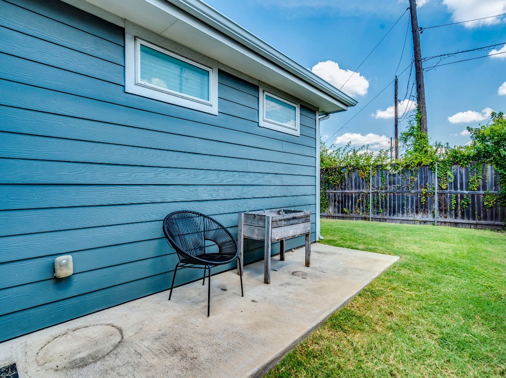2309 Hermia Street Austin, TX 78741 - Photo 26 of 30 a view of a chair and table in backyard of the house