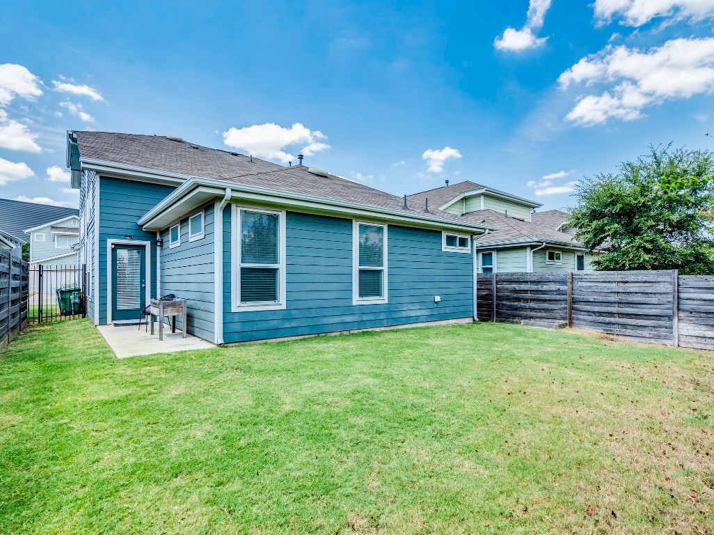 2309 Hermia Street Austin, TX 78741 - Photo 28 of 30 a view of a house with a yard and deck