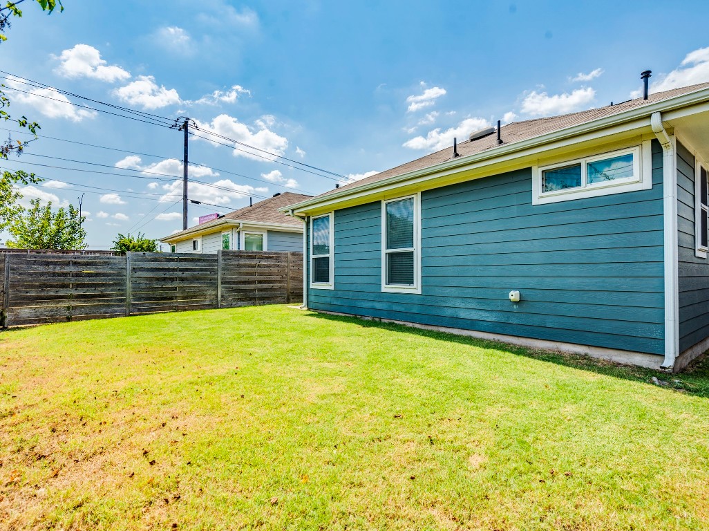 2309 Hermia Street Austin, TX 78741 - Photo 29 of 30 a view of a backyard with potted plants