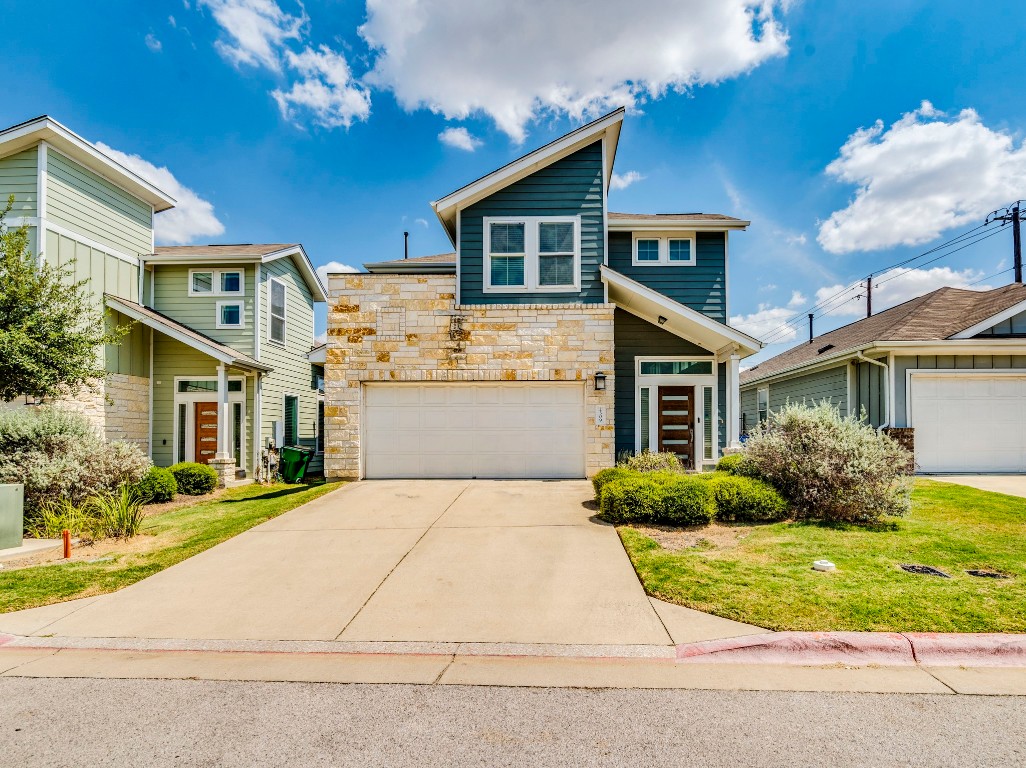 2309 Hermia Street Austin, TX 78741 - Photo 4 of 30 a front view of a house with a garden and plants