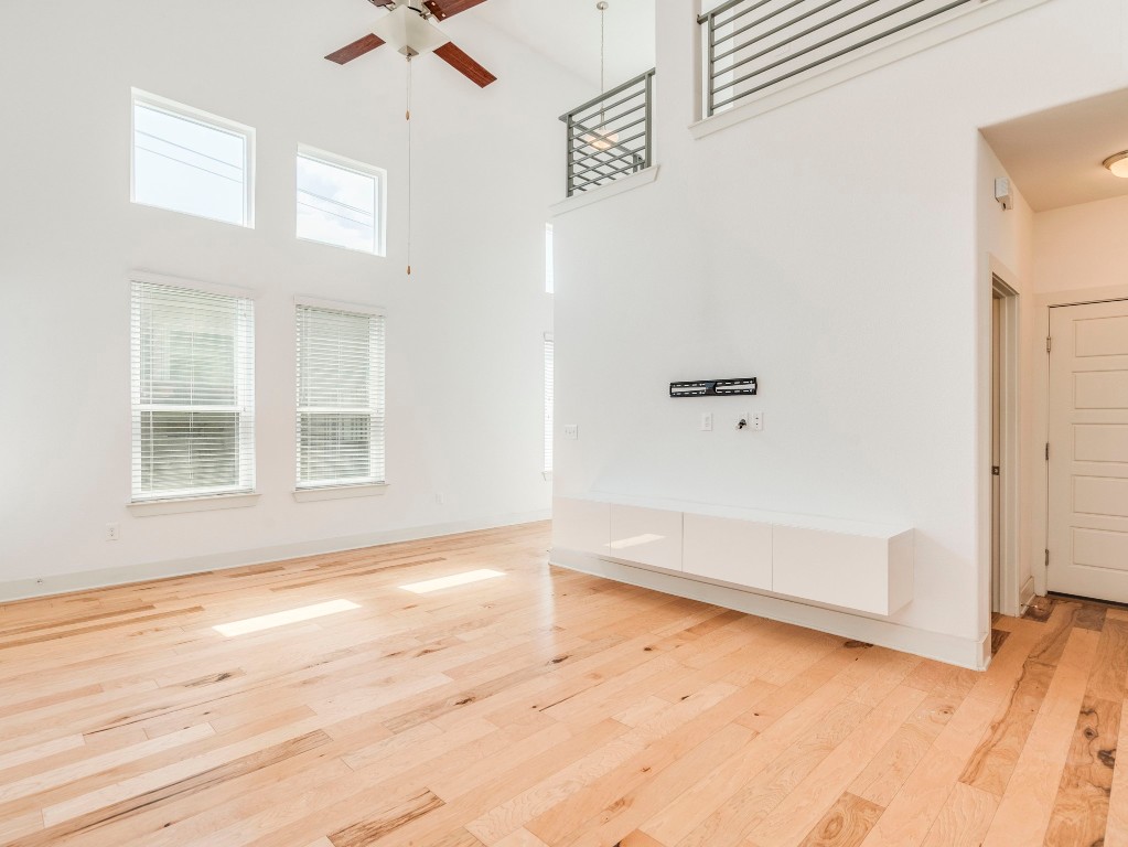 2309 Hermia Street Austin, TX 78741 - Photo 7 of 30 a view of an empty room with wooden floor and a window