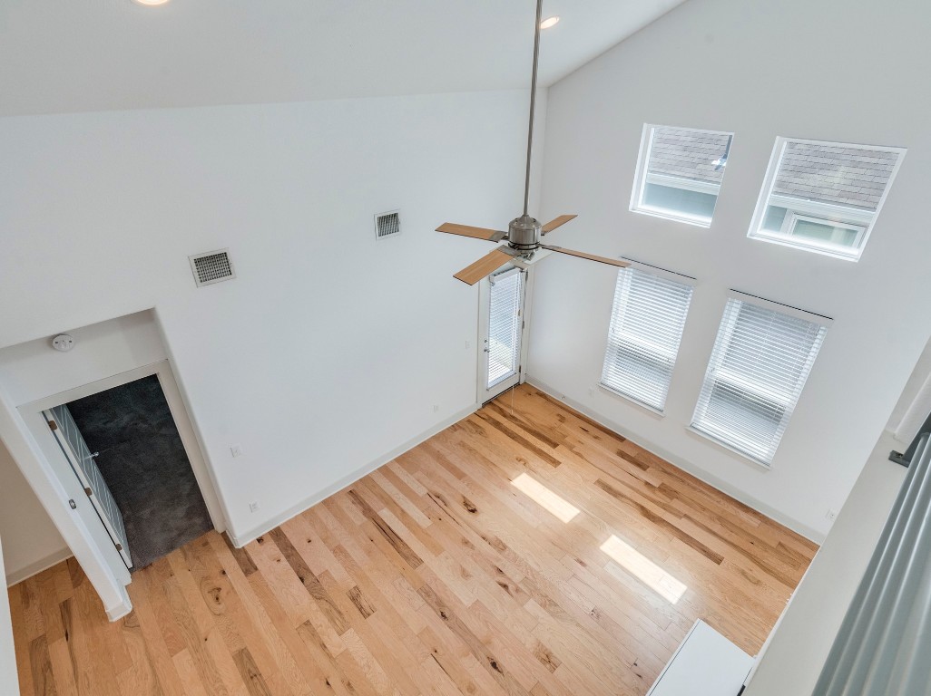 2309 Hermia Street Austin, TX 78741 - Photo 9 of 30 a view of empty room with wooden floor and fan