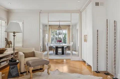a living room with furniture a window and a table