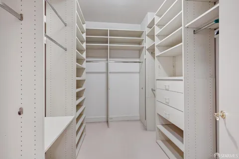 a bathroom with a bathtub a sink a vanity and a shower