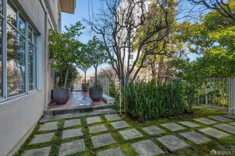 a view of a house with a tree