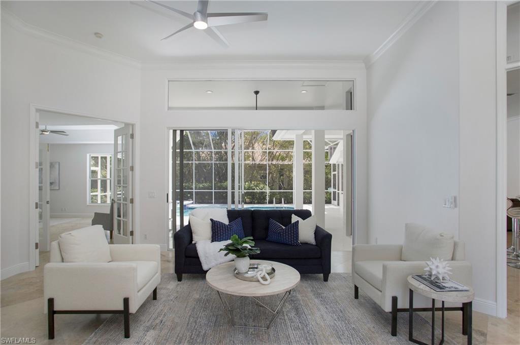1984 Mission Drive Naples, FL 34109 - Photo 12 of 50 a living room with furniture and a large window