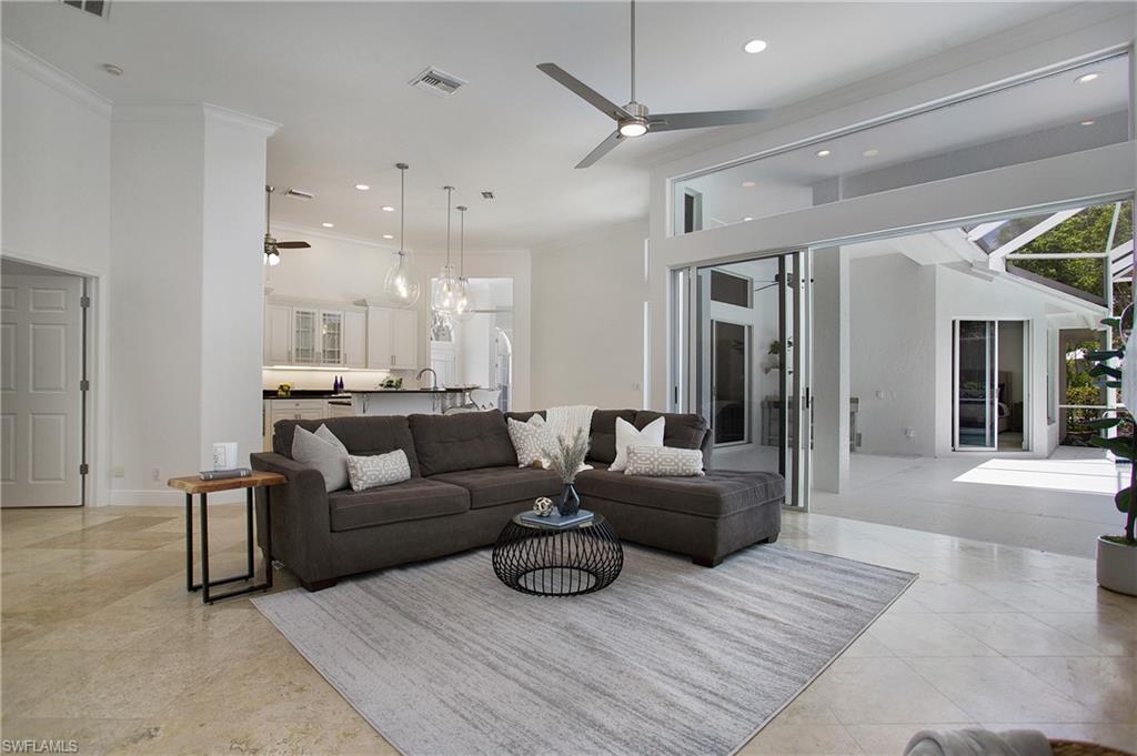 1984 Mission Drive Naples, FL 34109 - Photo 15 of 50 a living room with furniture and a wooden floor