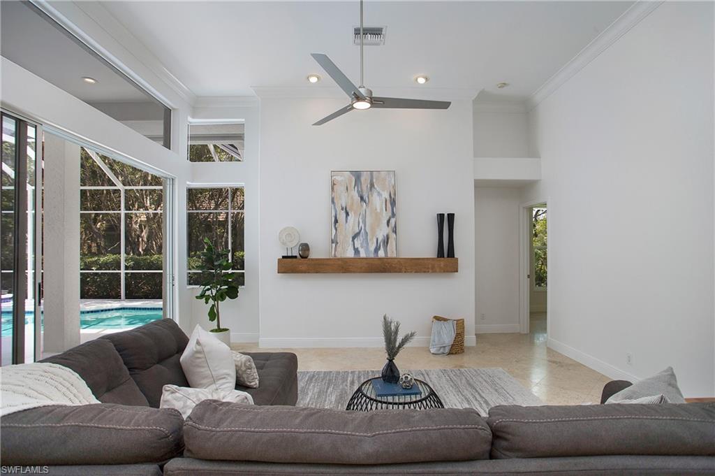 1984 Mission Drive Naples, FL 34109 - Photo 16 of 50 a living room with furniture and a large window