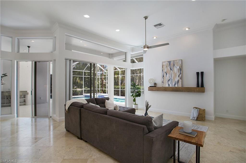 1984 Mission Drive Naples, FL 34109 - Photo 17 of 50 a living room with furniture and a large window
