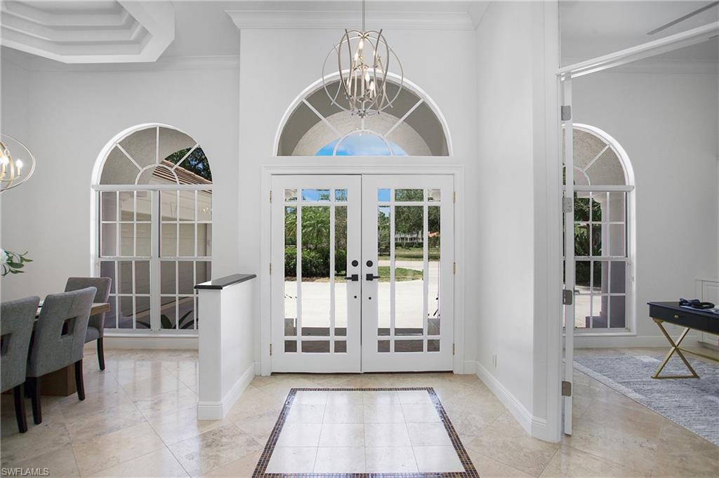 1984 Mission Drive Naples, FL 34109 - Photo 19 of 50 a view of a livingroom with wooden floor and furniture