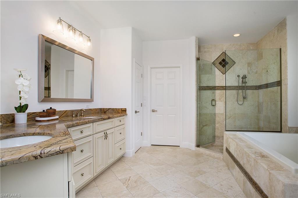 1984 Mission Drive Naples, FL 34109 - Photo 24 of 50 a bathroom with a granite countertop double vanity sink mirror and bathtub