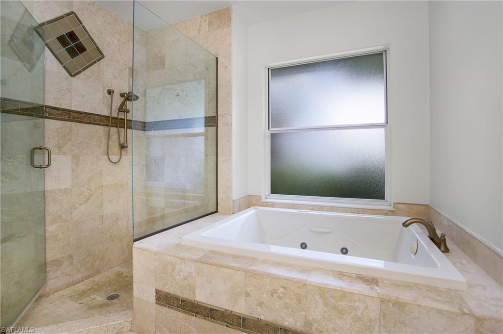 1984 Mission Drive Naples, FL 34109 - Photo 25 of 50 a bathroom with a bathtub