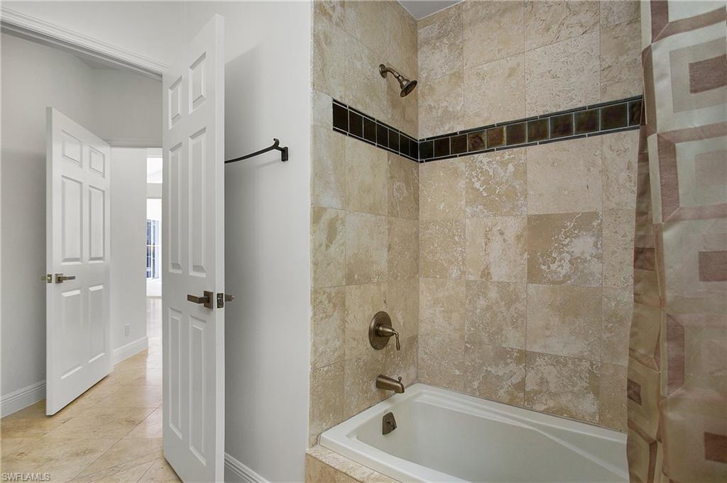 1984 Mission Drive Naples, FL 34109 - Photo 29 of 50 a bathroom with a shower and a tub