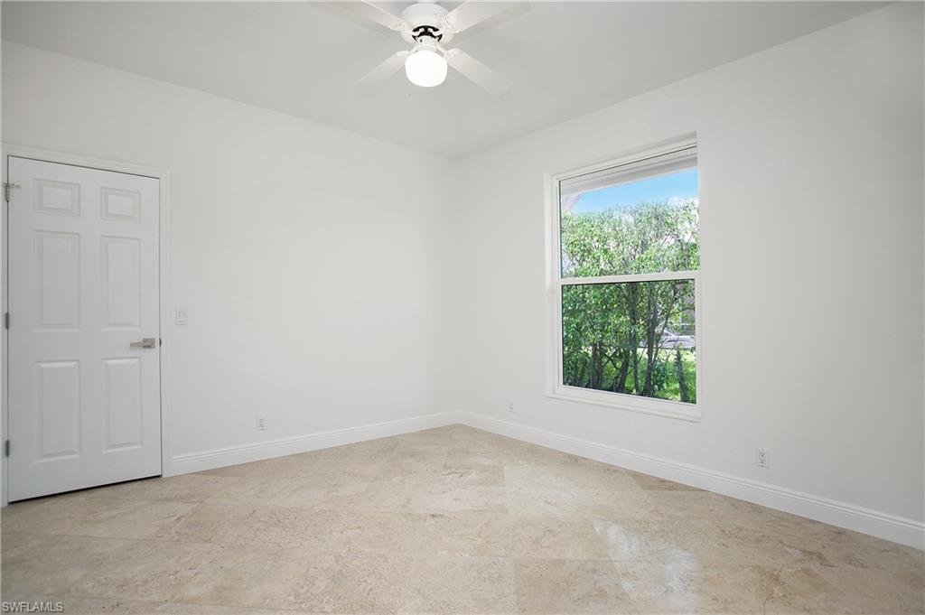 1984 Mission Drive Naples, FL 34109 - Photo 30 of 50 an empty room with a window