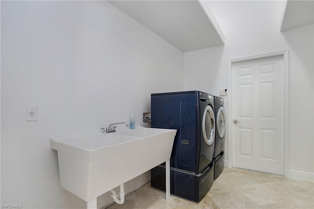 1984 Mission Drive Naples, FL 34109 - Photo 33 of 50 a bathroom with a sink and a mirror