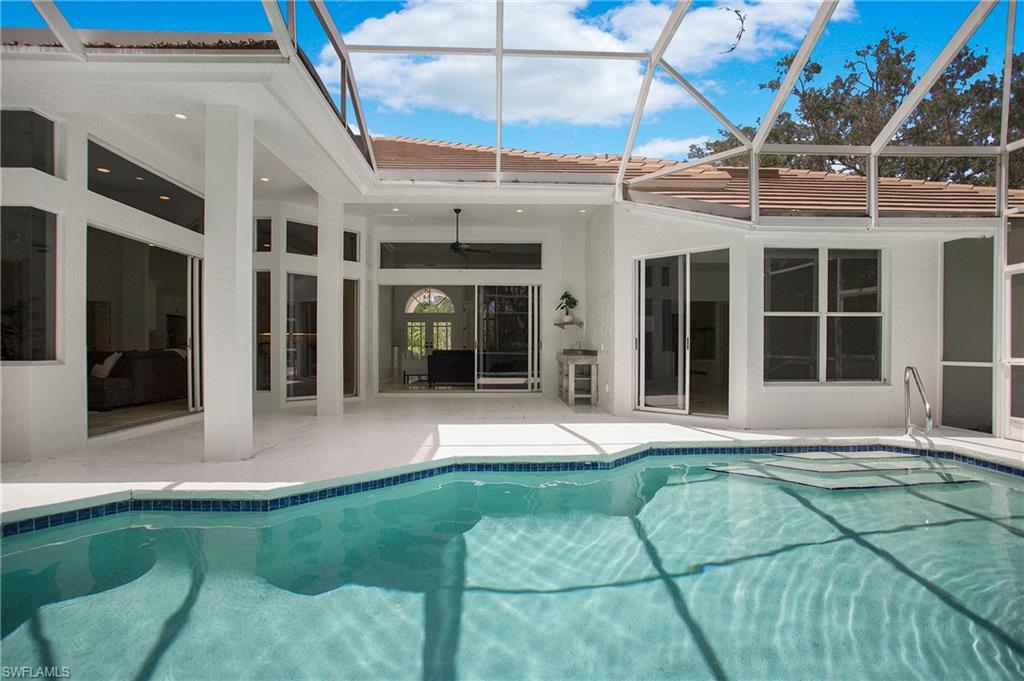 1984 Mission Drive Naples, FL 34109 - Photo 38 of 50 a view of a building with a backyard