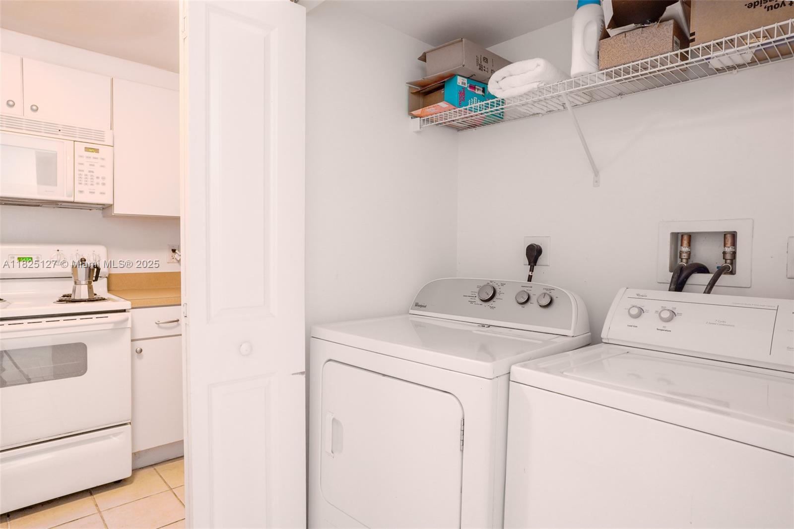 1250 South Miami Avenue, Unit 3003 Miami, FL 33130 - Photo 12 of 31 a utility room with dryer and washer
