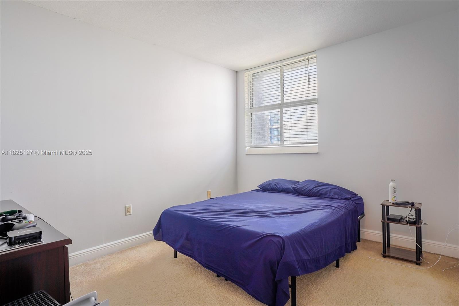 1250 South Miami Avenue, Unit 3003 Miami, FL 33130 - Photo 21 of 31 a bedroom with a bed and a window