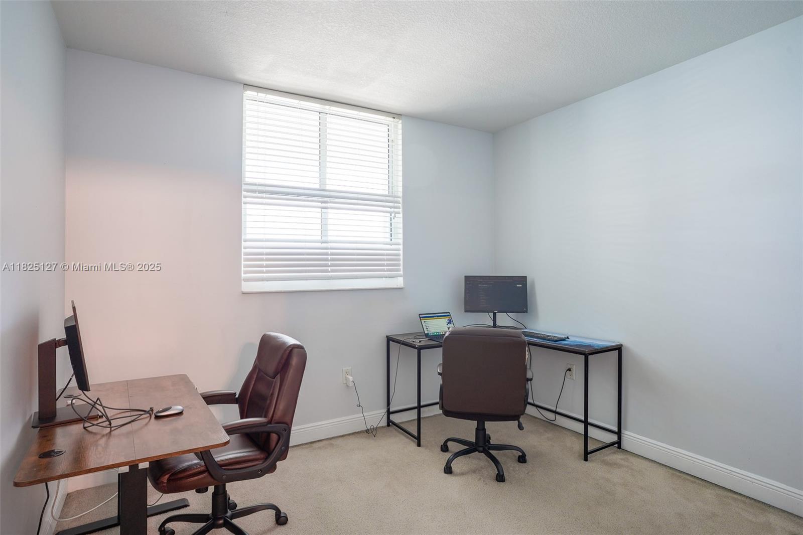 1250 South Miami Avenue, Unit 3003 Miami, FL 33130 - Photo 23 of 31 a view of a workspace with furniture and a window