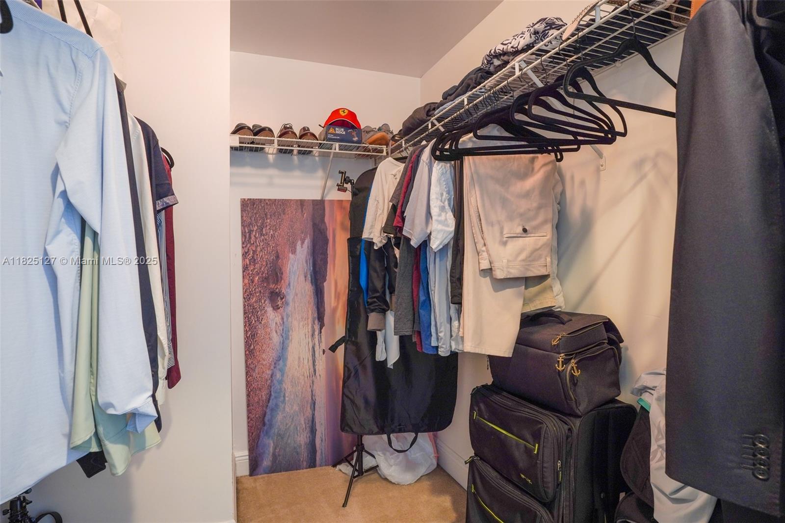 1250 South Miami Avenue, Unit 3003 Miami, FL 33130 - Photo 24 of 31 a view of walk in closet with clothes and shoes
