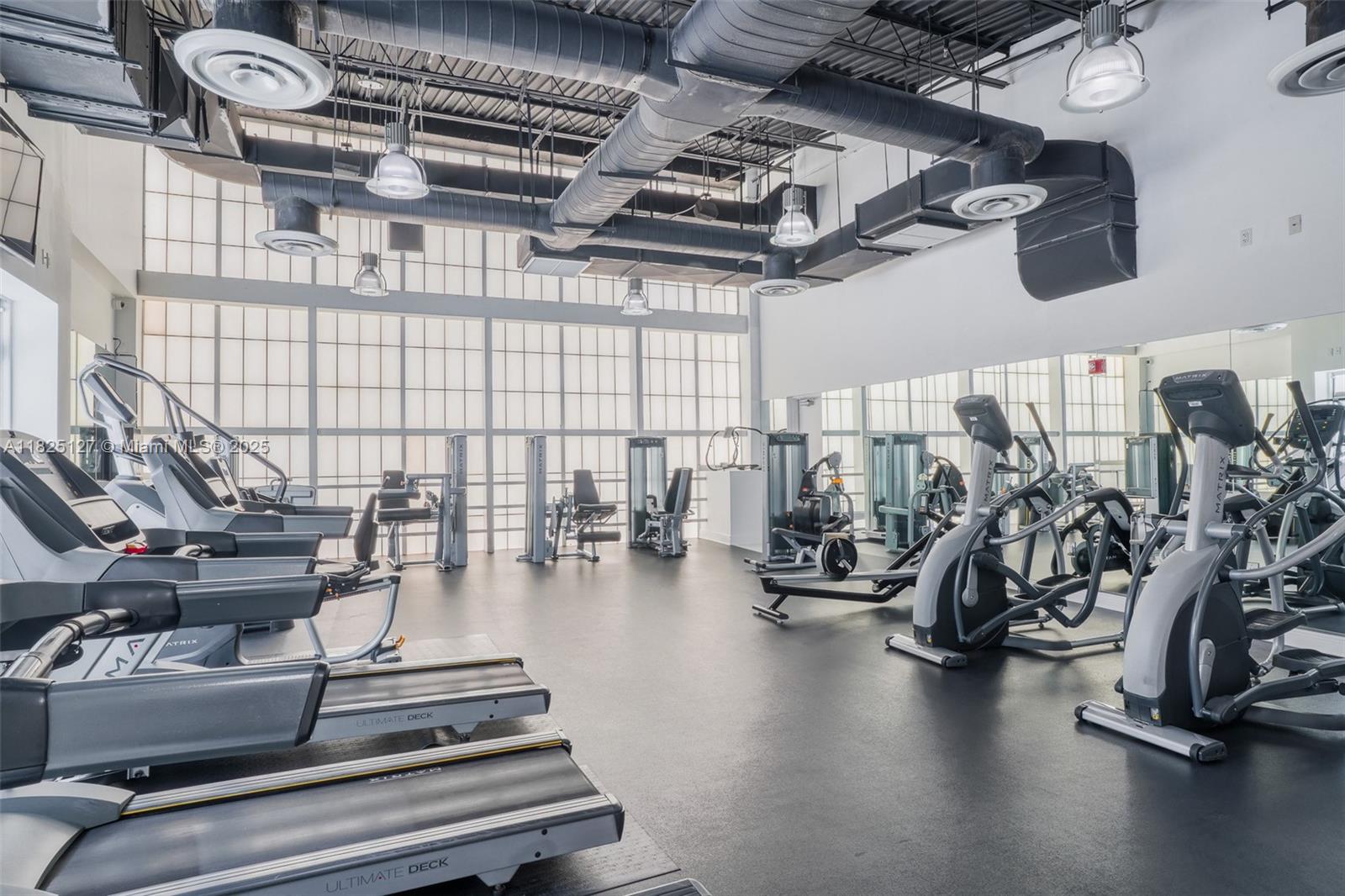 1250 South Miami Avenue, Unit 3003 Miami, FL 33130 - Photo 30 of 31 a gym room with lots of gym equipment